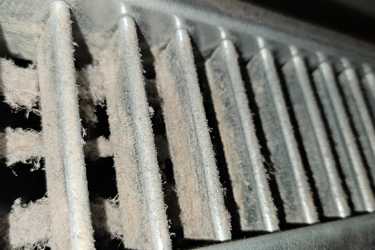 Before: Grille: dust clogging the gaps between the blades